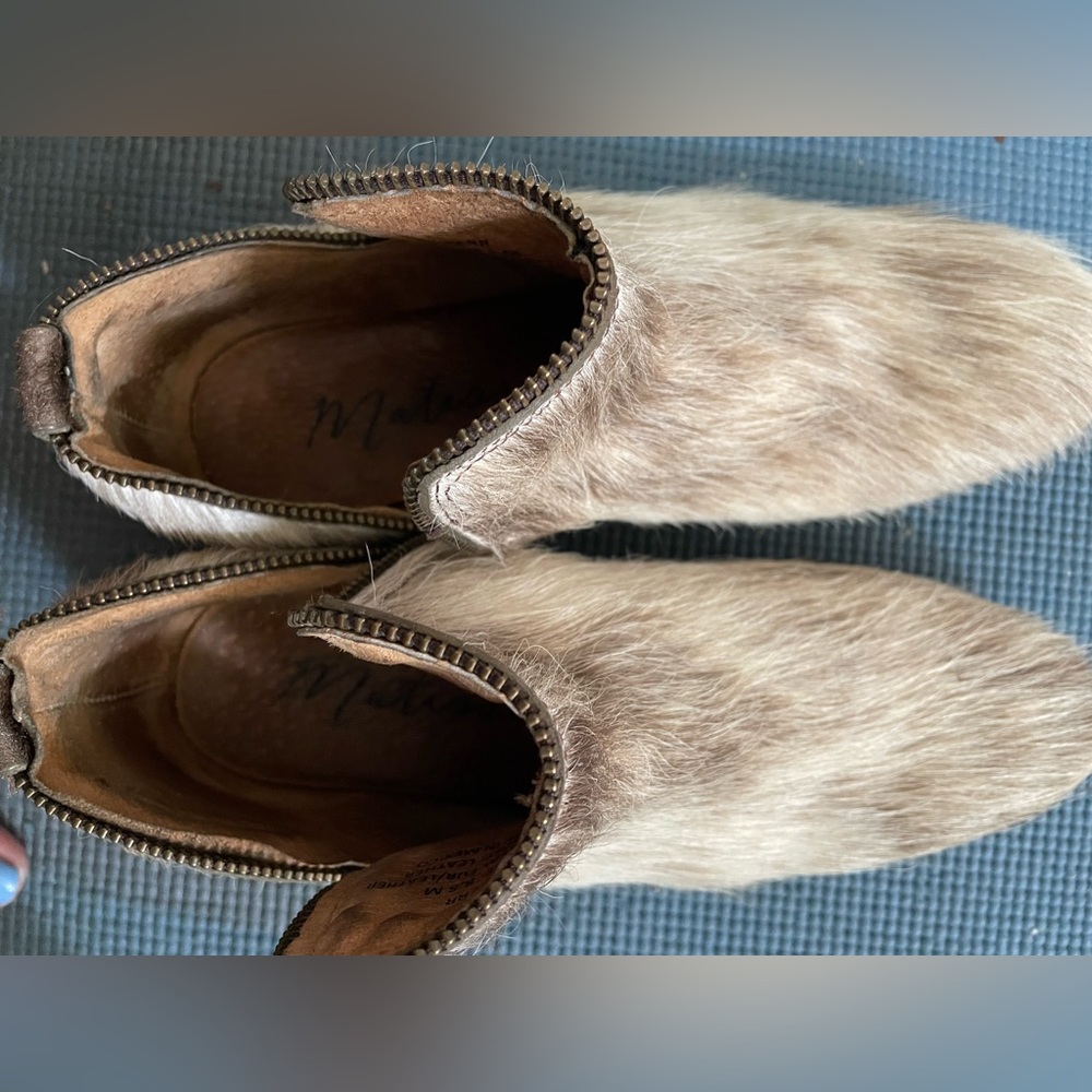 Brown and white boots. All leather with soft fur.